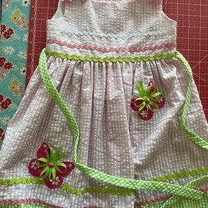 Cute seersucker Sun dress, Dotted ribbons and butterfly appliqués.  Rick Rack